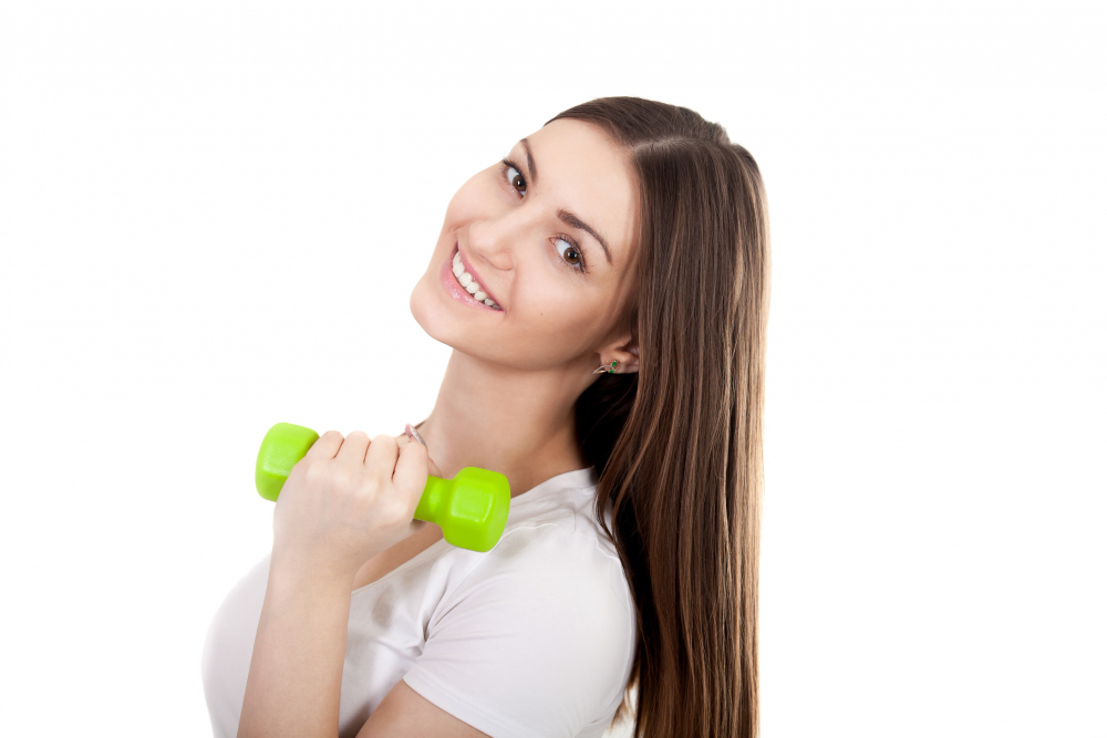 close-up-cheerful-girl-posing-with-green-dumbbell BFELE